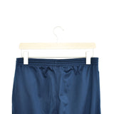 Vintage Lotto track pants tracksuit bottoms trousers in blue with red and white stripes.