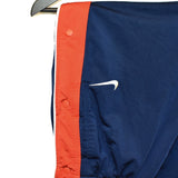 Vintage Nike track pants tracksuit bottoms in blue and red