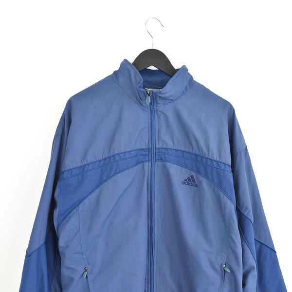Vintage Adidas windbreaker zip up jacket fleece track jacket bomber jacket jumper in dark blue.