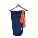 Vintage Nike track pants tracksuit bottoms in blue and red