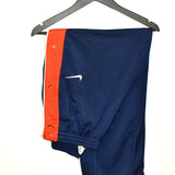 Vintage Nike track pants tracksuit bottoms in blue and red