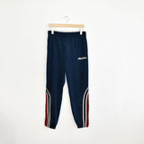 Vintage Lotto track pants tracksuit bottoms trousers in blue with red and white stripes.