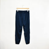 Vintage Lotto track pants tracksuit bottoms trousers in blue with red and white stripes.